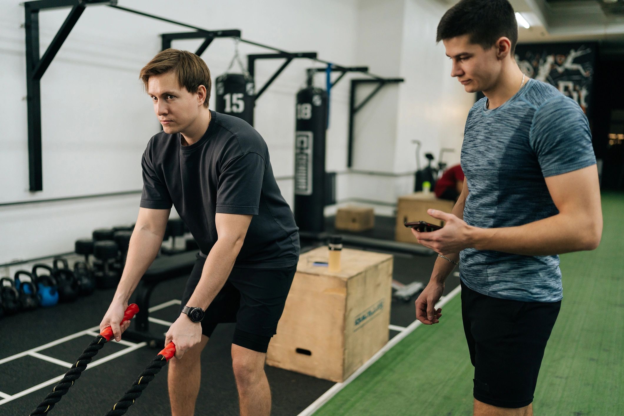 Athlete training with a coach in a gym setting